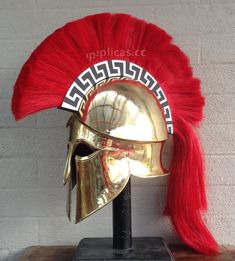 a helmet with red hair on top of a wooden table