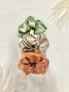 ♡ Handmade with care, this silky, satin scrunchie is a perfect accessory for your hair! Made from top-quality, satin fabric, these scrunchies are high quality and versatile. By purchasing this item, you're supporting a small business as well as adding a personal touch to your wardrobe! : ) ♡ Important Info:  This listing includes ONE scrunchie.  Silky, satin material Approx. 14cm in diameter  Elastic stretches to approx. 7 inches  Designed to wrap 2-3 times around average thickness hair The final seam is sewn with white thread and isn't noticeable. ♡ INSTRUCTIONS FOR CARE: 1. Hand washing recommended, or wash on gentle cycle 2. Do not tumble dry ♡ It's also important that you're completely satisfied with your product! If you have any questions or concerns, please contact me immediately! I' Satin Aesthetic, Aesthetic Scrunchies, Scrunchies Aesthetic, Neutral Silk, Satin Scrunchies, Silk Scrunchies, Satin Material, Satin Fabric, Silk Satin