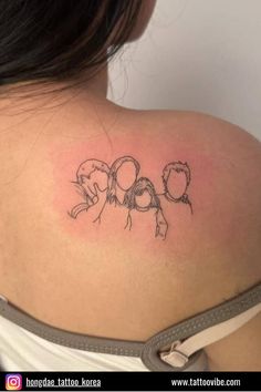 the back of a woman's shoulder with an outline of two people on it