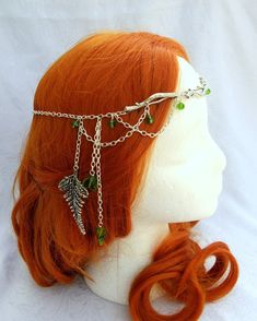 Handmade circlet of silver branch focal beads, accented with forest green crystals. Swags of silver chain loop on either side of this unique head piece, accented with a silver fern leaf on one side. This circlet is fully adjustable and fits children to adults! Clasps in back with a lobster clasp. PLEASE NOTE: THIS ITEM IS MADE TO ORDER, CRYSTAL BEADS MAY VARY IN SIZE AND SHAPE DUE TO AVAILABILITY AND COLOR. IF YOU HAVE QUESTIONS PLEASE CONTACT ME. THANKS!! Please convo me with any questions or r Warrior Hair, Elf Crown, Epic Clothes, Forest Elf, Steampunk Wedding, Trending Items, Money Makers, Hair Jewellery, Head Pieces