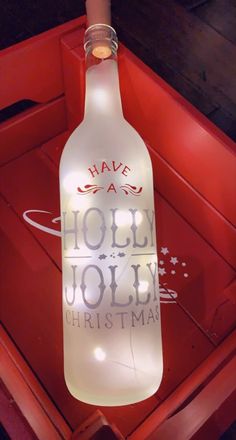 a lighted bottle that says have a holly jolly christmas