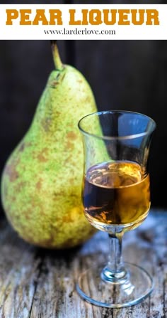 pear liquor in a glass next to a pear