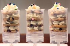 three plastic containers filled with desserts on top of a table