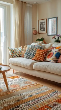 a living room filled with lots of colorful pillows