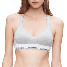 An updated Calvin Klein icon. Cut in a sports bra silhouette and crafted with a super-soft, cotton-blend construction, this women's bralette is perfect for low-impact workouts or everyday wear. An updated Calvin Klein icon. Cut in a sports bra silhouette and crafted with a super-soft, cotton-blend construction, this women's bralette is perfect for low-impact workouts or everyday wear. Padded cups Crossback straps with keyhole opening Lift construction Calvin Klein logo bandFIT & SIZING Easy Medium Support Cotton Sports Bra For Loungewear, Cotton Medium Support Sports Bra For Loungewear, Cotton Sports Bra With Medium Support For Loungewear, Sporty Cotton Sports Bra With Built-in Bra, Gym Bra With Removable Pads, Cotton Athleisure Sports Bra With Built-in Bra, Sporty Cotton Sports Bra For Loungewear, Calvin Klein Medium Support Sports Bra For Workout, Fitted Cotton Sports Bra With Light Support