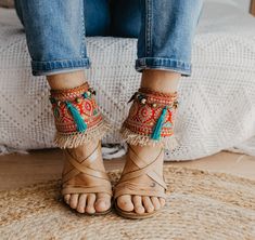 These Boho Sandals Ankle Belts will help you to completely transform any basic sandal into something stylish and unique. They are made with carefully selected ethnic materials, in a completely handmade process. With them, you will get those sandals that you wear everywhere and have super comfortable, have a different air when you want. In this way, you can enhance that Boho-Chic style that we love so much. This ad is for a pair of anklets, footwear is not included. If you need a custom design or for a girl, do not hesitate to write to me and we will design it together. The anklets are adjustable to fit a variety of widths. Handmade design Made with multicolored trimmings, and natural color fringes and aqua green tassel Adjustable leather straps Measurements for decorative part of the ankle Spring Festival Multicolor Anklets, Bohemian Barefoot Sandals With Ankle Strap For Spring, Bohemian Ankle Wrap Sandals For Spring, Bohemian Ankle-wrap Sandals For Spring, Bohemian Ankle Wrap Anklets For Vacation, Bohemian Embroidered Sandals For Beach, Bohemian Ankle Strap Anklets For Festivals, Bohemian Summer Anklets With Ankle Strap, Bohemian Ankle Wrap Anklets For Festivals