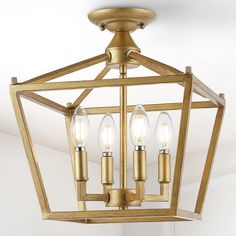 an image of a light fixture with three lights on it's sides and two bulbs hanging from the ceiling