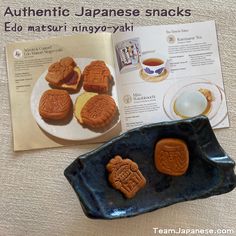 an open book with cookies and tea on it