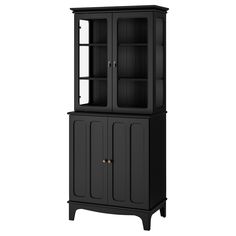 a black china cabinet with glass doors and shelves on the bottom, in front of a white background