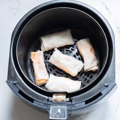 dumplings are being cooked in an air fryer