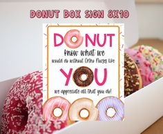 donuts in a box with a sign that says, donut box sign 8x10