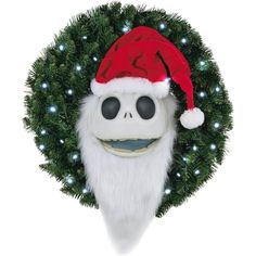 a skeleton wearing a santa claus hat in front of a christmas wreath with lights on it