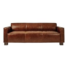 a brown leather couch sitting on top of a white floor