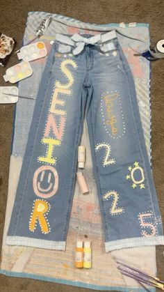 #senior #pastel #seniorjeans Senior Pants Overalls, Senior Sunrise Jeans, Senior Jeans Painted 2025, Homecoming Jeans Decorated, Senior Year Jeans, Senior Jeans Ideas, Hoco Overalls