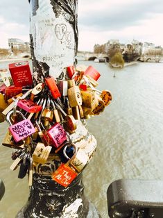 a bunch of locks attached to a pole