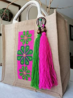 a jute bag with tassels on it