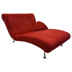 a red chaise lounge chair on chrome legs