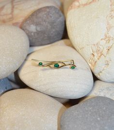 ⋙ 14kt Gold Filled emerald ear climber. ⋙ This listing is for one ear climber. ⋙ Available gemstones: ruby; lapis lazuli; black onyx; emerald; light blue opal; garnet; white opal; kiwi green opal; amethyst; aqua blue cz; clear cz; black-red opal; turquoise; blue sapphire ⋙ Measurements: ⋙ The stones are 2mm and 3mm in diameter ⋙ ⋙ I will put your order into a beautiful jewelry box (it will be ready for gift giving). Ear Sweeps, Ear Climber Earrings, Ear Crawler, Red Opal, Ear Climbers Earrings, Ear Crawlers, Ear Climber, Ear Pins, Ear Earrings