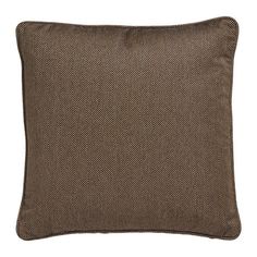 a brown pillow on a white background