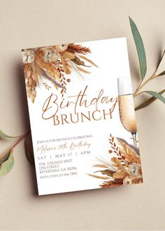 a birthday brunch party with flowers and greenery