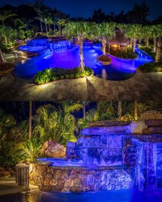 an outdoor swimming pool surrounded by palm trees at night and in front of a waterfall