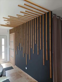 a living room with wood slats on the wall