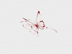 a red butterfly flying through the air on top of a white paper background with watercolor paint