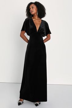 Draw everyone in with your enchanting presence in the Lulus Mystical Charm Black Velvet Flutter Sleeve Maxi Dress! Plush slightly stretchy velvet shapes this chic dress that features a plunging V-neckline, a gathered bodice, and short dolman-style flutter sleeves. Empire waist sits atop a column skirt that falls to a sophisticated maxi hem with a thigh-high slit at the side. Turn around to reveal an alluring keyhole-inspired cutout that secures with a button loop closure. Hidden back zipper/clas Black Velvet Formal Dress, Long Black Velvet Dress, Black Bridesmaid Dresses Velvet, Black Long Sleeve Velvet Bridesmaid Dress, Black Flowy Maxi Dress With Flutter Sleeves, Anthropology Black Dress, Short Sleeve Black Velvet Dress, Chic Black Velvet V-neck Dress, Black V-neck Maxi Dress With Flattering Silhouette