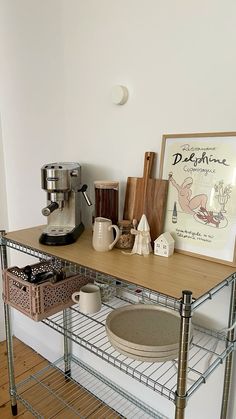 a shelf with some items on top of it and a coffee maker next to it