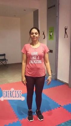 a woman is standing on the floor in front of an exercise mat that says, i like to rock star