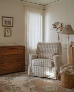 a baby's room with a rocking chair and dresser