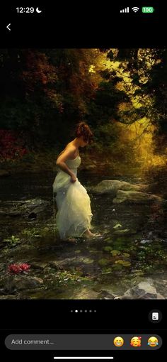 a woman in a white dress is standing in the water