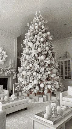 a white christmas tree in a living room