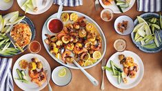 a table topped with plates filled with food