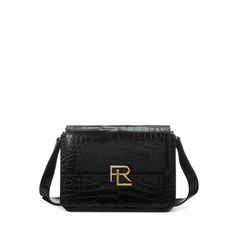 Ralph Lauren’s RL 888 collection was named in honor of our historic women’s flagship at 888 Madison Ave. in New York City where the juxtaposing worlds of Ralph Lauren convene and inspire. A strong silhouette with a spirit of independence the RL 888 Crossbody is inspired by the architecture of Mr. Lauren’s birthplace. Featuring a dual-compartment interior and an adjustable crossbody strap accented by two polished keepers each bag is exquisitely made by hand and individually constructed in Italy w Historic Women, Ralph Lauren Bag, American Alligator, Ralph Lauren Bags, Travel Handbags, Handbags Tote, Luxury Accessories, Duffel Bag, Handbag Accessories