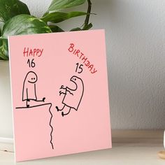 a pink birthday card with two cartoon figures on it