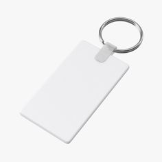 a white keychain with a blank tag attached to it