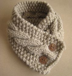 a knitted hat with buttons on the side