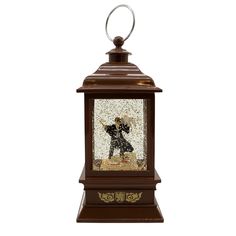 a decorative lantern with a dog on it