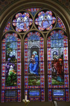 a stained glass window in the inside of a church