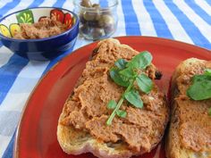 two pieces of bread sit on a red plate