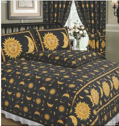 the sun and moon bedding set is black with gold accents, along with matching curtains