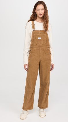 Find LEVI'S Full Length Baggy Overalls on Editorialist. Fabric: Mid-weight, non-stretch corduroy. Kangaroo pocket at front. Buttons at sides. Slant hip pockets and patch back pockets. Shell: 100% cotton. Wash cold. Imported, Cambodia. Measurements: Measurements from size XS Inseam: 30in / 76cm Leg opening: 19in / 48cm Levis Overalls, Baggy Overalls, Levis Outfit, American Workwear, Corduroy Overalls, American Style, Cambodia, Kangaroo Pocket, Kangaroo