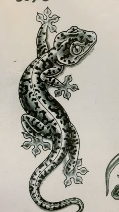 a drawing of a gecko sitting on top of a piece of paper