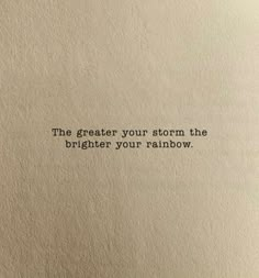 an old typewriter with the words'the greater your storm, the brighter your rainbow '