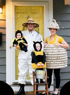 a man and two children dressed up in costumes