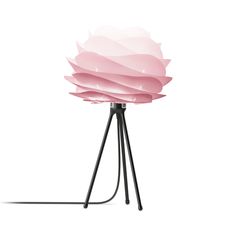 a pink flower lamp sitting on top of a black tripod