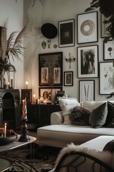 a living room filled with lots of pictures and candles on the wall next to a fire place