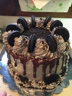 a cake with oreo cookies and cream frosting