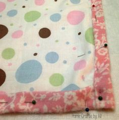 a close up of a piece of fabric with buttons on the side and some holes in it